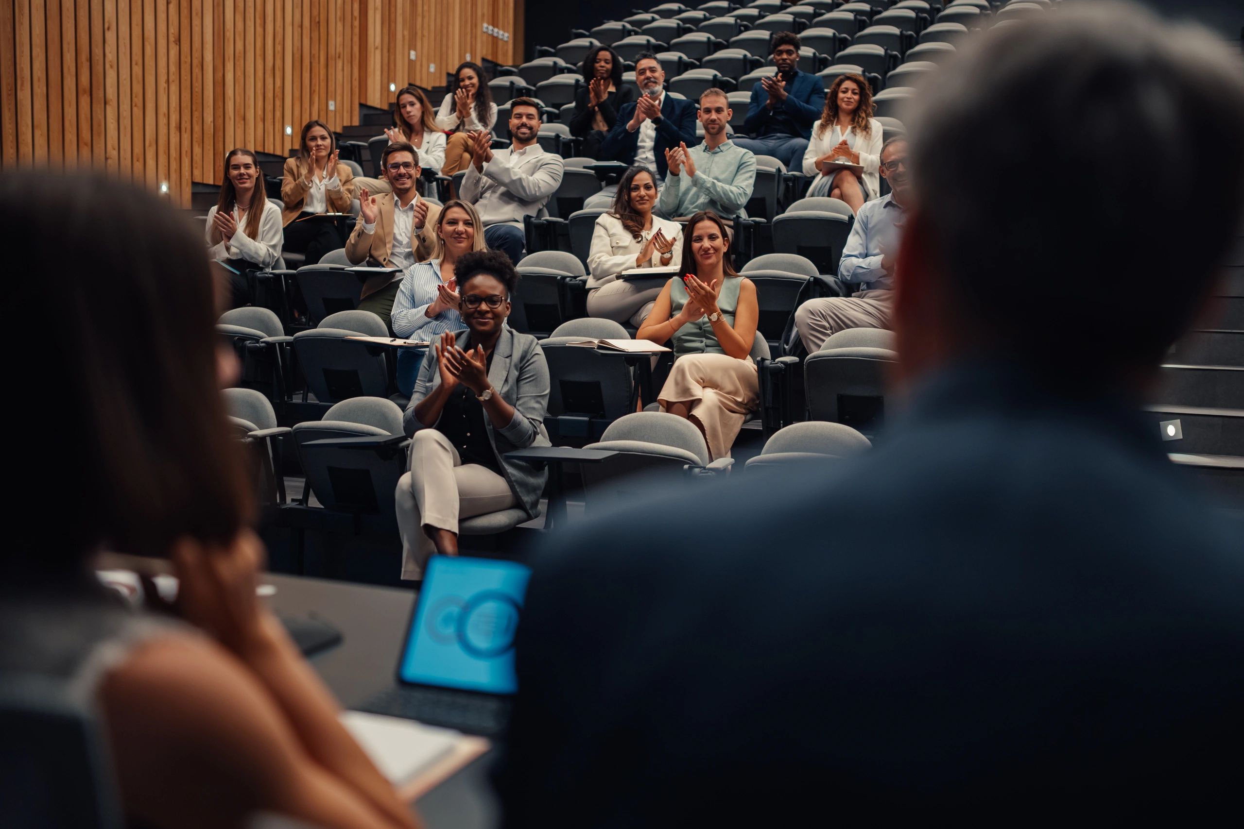 Audience applauding at a community event